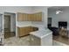Bright kitchen featuring stainless steel appliances, light-colored cabinets, an island, and stone tile flooring at 1625 Brisbane Dr, Dacula, GA 30019
