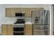 Modern kitchen featuring stainless steel appliances, ample cabinet space, and sleek countertops for easy cooking at 1625 Brisbane Dr, Dacula, GA 30019