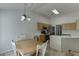 Bright kitchen with modern appliances, light-colored cabinets, and a dining area at 1625 Brisbane Dr, Dacula, GA 30019