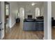 Open-concept living room showcasing hardwood floors, a fireplace, and views into other rooms at 1625 Brisbane Dr, Dacula, GA 30019