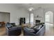 Spacious living room boasting vaulted ceilings, a cozy fireplace, and abundant natural light at 1625 Brisbane Dr, Dacula, GA 30019