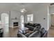 Spacious living room with a fireplace, hardwood floors, and archways at 1625 Brisbane Dr, Dacula, GA 30019