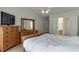 Spacious main bedroom featuring wood furniture, a large window, and access to the bathroom at 1625 Brisbane Dr, Dacula, GA 30019