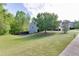 A large backyard with green grass and tree line, providing a spacious and private outdoor area at 1625 Brisbane Dr, Dacula, GA 30019