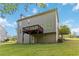 Exterior of a house with a green backyard, elevated deck, and walkout basement at 1650 Berryhill Rd, Cumming, GA 30041