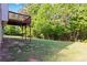 Lush backyard and an elevated deck in a serene, wooded setting at 1650 Berryhill Rd, Cumming, GA 30041