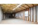 Unfinished basement with exposed ceiling and windows allowing natural light at 1650 Berryhill Rd, Cumming, GA 30041