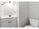 Bathroom featuring a vanity with storage and modern fixtures next to the toilet at 1650 Berryhill Rd, Cumming, GA 30041