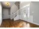Elegant foyer with hardwood floors, wainscoting, and a decorative glass front door at 1650 Berryhill Rd, Cumming, GA 30041