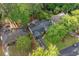 Aerial view of property showing the roof and surrounding landscaped greenery and driveway at 1866 Wildwood Ne Pl, Atlanta, GA 30324