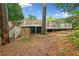 Expansive backyard featuring mature trees, a deck, stairs, and outdoor storage shed at 1866 Wildwood Ne Pl, Atlanta, GA 30324