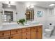 A bright bathroom features double sinks, modern fixtures, and a granite countertop at 1866 Wildwood Ne Pl, Atlanta, GA 30324