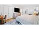 Bedroom with hardwood floors has a large dresser, closet, and doorway to the bathroom at 1866 Wildwood Ne Pl, Atlanta, GA 30324