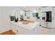 Modern kitchen with stainless steel appliances, white cabinetry, and a quartz countertop island at 1866 Wildwood Ne Pl, Atlanta, GA 30324