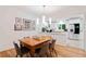 Bright eat-in kitchen with white cabinets, stainless steel appliances, and a wood dining table at 1866 Wildwood Ne Pl, Atlanta, GA 30324