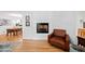 Elegant living area featuring hardwood floors, a fireplace, and comfortable seating at 1866 Wildwood Ne Pl, Atlanta, GA 30324