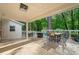The spacious covered patio has a beautiful wood ceiling, recessed lighting, and natural landscape views at 1866 Wildwood Ne Pl, Atlanta, GA 30324