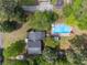 Bird's-eye view of a home with a pool, driveway, and mature trees at 2994 Cathy Ann Nw Ct, Acworth, GA 30101