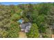 Aerial view of a home with a pool, surrounded by lush trees and greenery at 2994 Cathy Ann Nw Ct, Acworth, GA 30101