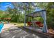 Beautiful backyard featuring a gazebo with red seating and a blue pool, great for entertaining at 2994 Cathy Ann Nw Ct, Acworth, GA 30101
