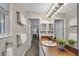Neutral bathroom featuring a large mirror, ample lighting, and modern fixtures at 2994 Cathy Ann Nw Ct, Acworth, GA 30101
