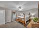 Inviting bedroom featuring a four-poster bed, neutral walls, and a window with natural light at 2994 Cathy Ann Nw Ct, Acworth, GA 30101