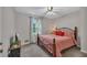 Comfortable bedroom features a ceiling fan and a large window with natural light at 2994 Cathy Ann Nw Ct, Acworth, GA 30101
