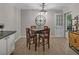Cozy dining room featuring a wooden table set, modern light fixture, and adjacent decor at 2994 Cathy Ann Nw Ct, Acworth, GA 30101
