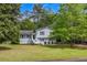 Inviting two-story home featuring a well-maintained lawn and cozy front porch at 2994 Cathy Ann Nw Ct, Acworth, GA 30101