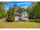 Two-story home with a cozy front porch and lush green lawn at 2994 Cathy Ann Nw Ct, Acworth, GA 30101