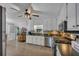 Bright kitchen with white cabinets, stainless steel appliances, and hardwood floors at 2994 Cathy Ann Nw Ct, Acworth, GA 30101