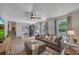 Well-lit living room featuring modern décor, hardwood floors, and a comfortable seating area at 2994 Cathy Ann Nw Ct, Acworth, GA 30101