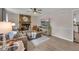 Spacious living room featuring a stone fireplace, a large TV, and open floor plan at 2994 Cathy Ann Nw Ct, Acworth, GA 30101