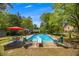 Beautiful pool area with a diving board and comfortable lounge chairs, perfect for summer days at 2994 Cathy Ann Nw Ct, Acworth, GA 30101