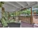 Inviting screened-in porch with comfortable seating area, overlooking beautiful backyard at 2994 Cathy Ann Nw Ct, Acworth, GA 30101