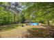 Expansive backyard with lush greenery and an in-ground pool for outdoor enjoyment at 2994 Cathy Ann Nw Ct, Acworth, GA 30101