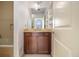 Bathroom with a vanity, large mirror, and built-in shelves next to a bathtub at 57 Forsyth Nw St # 12E, Atlanta, GA 30303