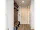 Hallway with exposed brick, overhead storage, and a built-in bench at 57 Forsyth Nw St # 12E, Atlanta, GA 30303