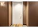 Apartment hallway entrance with neutral colors, carpeted floor, and a 'OH HELLO' welcome mat at 57 Forsyth Nw St # 12E, Atlanta, GA 30303
