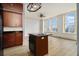 Charming kitchen area with city views from the large windows and a center island at 57 Forsyth Nw St # 12E, Atlanta, GA 30303
