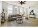 Bright living room with large windows, hardwood floors, and modern furnishings with city views at 57 Forsyth Nw St # 12E, Atlanta, GA 30303