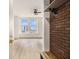 Bright, open living room with large windows offering city views and a ceiling fan at 57 Forsyth Nw St # 12E, Atlanta, GA 30303