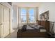 Cozy bedroom with a double window showcasing a city view and a comfortable bed at 57 Forsyth Nw St # 12E, Atlanta, GA 30303