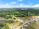 Picturesque aerial view of a residential neighborhood surrounded by trees at 837 Porches Way, Dacula, GA 30019