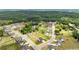An aerial view shows the property's location in a well-planned community with a pond and lush greenery at 837 Porches Way, Dacula, GA 30019