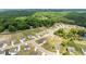 Overhead view of a suburban development with homes, community pool, and wooded areas at 837 Porches Way, Dacula, GA 30019