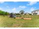 Expansive backyard featuring a storage shed and raised garden beds at 837 Porches Way, Dacula, GA 30019