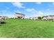A lush backyard with ample green space and well maintained lawn in a Gathering friendly neighborhood at 837 Porches Way, Dacula, GA 30019