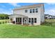 Spacious backyard featuring covered patio and ample green space at 837 Porches Way, Dacula, GA 30019