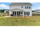 Expansive backyard with a covered patio and lush green lawn, ideal for outdoor living and entertaining at 837 Porches Way, Dacula, GA 30019